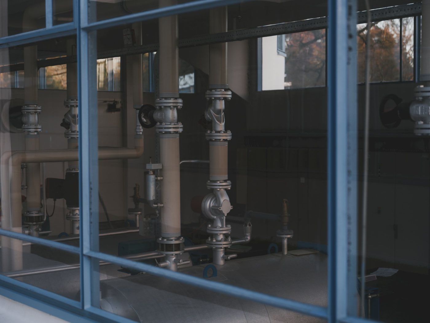 Flanged pipe assembly seen through a window