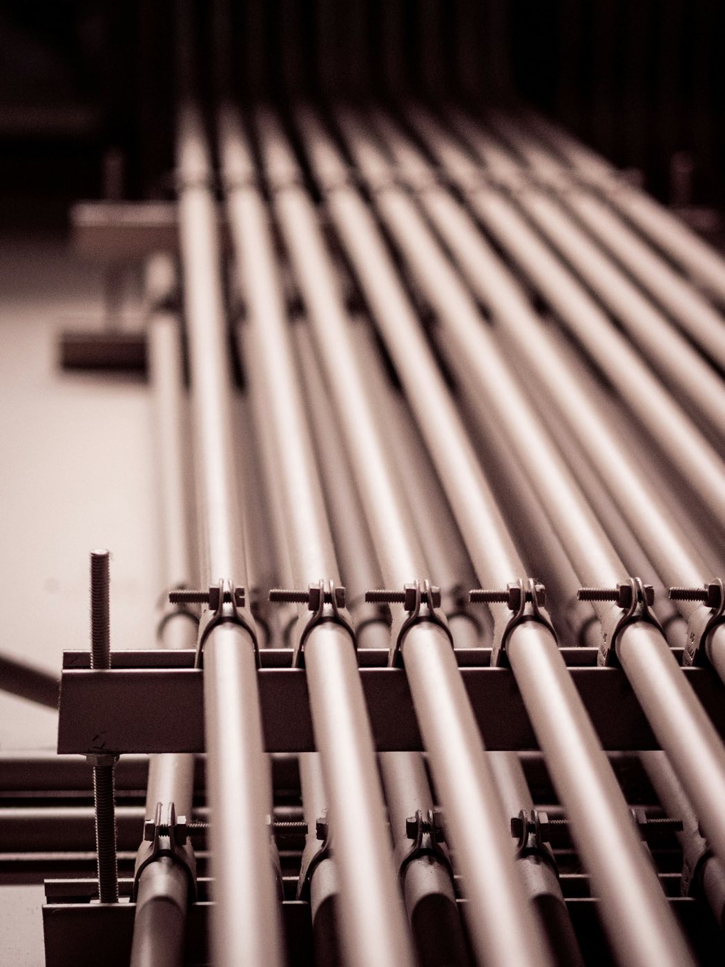 Rows of steel pipes in a production line