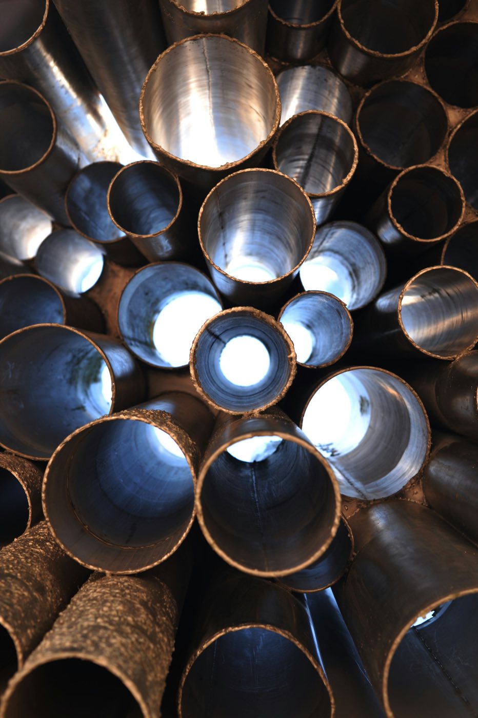 Close-up of steel pipe ends stacked together